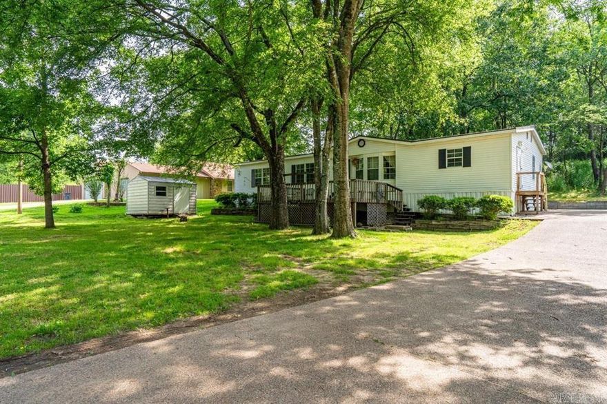 Spacious and comfortable, this 3-bedroom, 2-bath mobile home sits on a generous 0.60-acre lot in the highly regarded Cutter Morning Star School District. There’s plenty of room inside and out for kids to play, pets to roam, and families to grow.  Just minutes from downtown Hot Springs, you’ll enjoy the peace of country living with the convenience of the city close by. The large backyard offers endless possibilities for outdoor fun, gardening, or future projects.  Move-in ready and waiting for your family’s next chapter—this is the perfect place to call home!