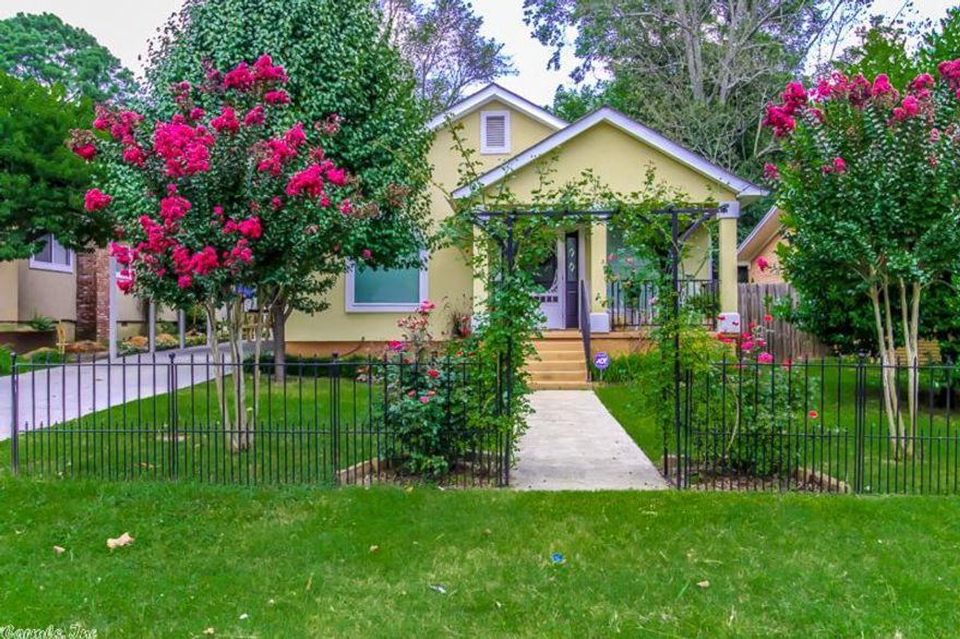Welcome Home!  From the moment you walk through the wrought iron arch and up to the attractive front porch and Victorian screen door, you'll know you have arrived home.  This neat, well landscaped stucco home is a beauty inside and out as it has been completely redone recently.  From the laminate flooring in the open living/dining/kitchen area to the abundant new cabinets in the kitchen to the new windows, this is top notch.  The well landscaped large backyard is gorgeous with a gazebo and potting shed.
