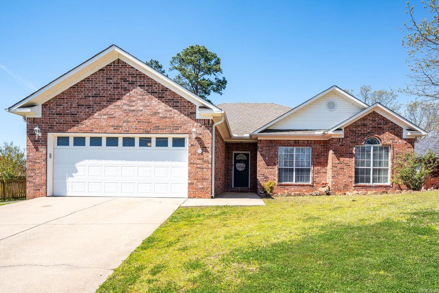 Wonderful 3 bed/2 bath Maumelle home with separate office/dining space, spacious primary suite, great backyard, next to neighborhood walking trail! The large living area has a gas fireplace as the focal point with access to the back deck. The kitchen has been updated with opening the space into the living room & new appliances. The large primary suite w/beautiful wood tray ceiling, an oversized walk-in closet, jet tub, double sinks, walk-in shower. The guest rooms are a nice size and share the hall bath. New light fixtures, new paint throughout, updated landscaping with new mulch, great backyard and two car garage.