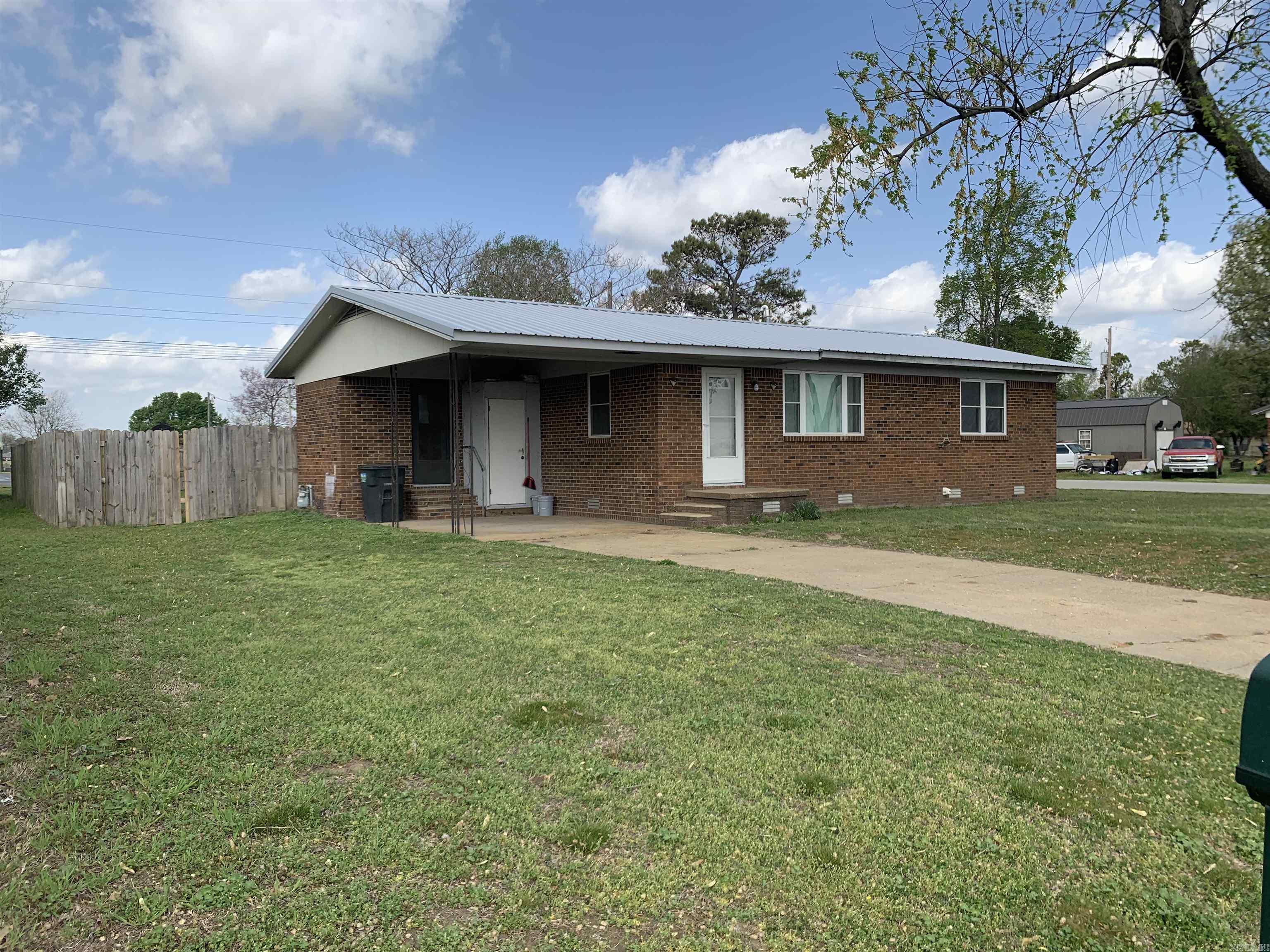 Nice house for first time homebuyers or would make a great rental. Large living area with new carpet, kitchen and dining combo, large laundry room with storage area, two large bedrooms with nice sized closets, full bath recently redone. The back yard is totally encompassed by a wood privacy fence, storage building/shop and a chicken house just waiting for the chickens to arrive.