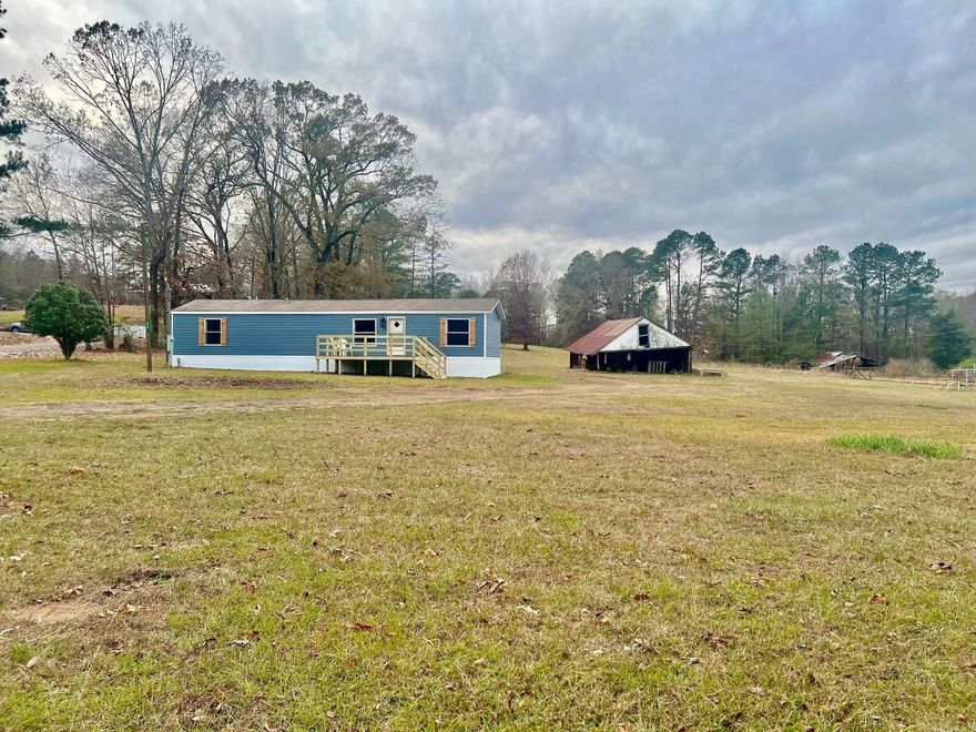 Discover peaceful country living on 9.3 beautiful acres at this updated 2-bedroom, 2-bath mobile home set on a permanent foundation. This property offers the perfect blend of quiet seclusion and modern comfort, ideal for anyone looking for space to spread out, enjoy nature, or start a small homestead.   The home has been thoughtfully updated, featuring All new siding and underpinning, New decks on the front and back, a bright and functional layout with an open living area, a well-appointed kitchen, and comfortable bedrooms on opposite ends for added privacy. Both bathrooms have been refreshed, and the home is move-in ready with updates that make everyday living easy.   Step outside to open pasture perfert for livestock, or horses with beautiful wooded acrage in the back for the wildlife enthusiast.  The property’s generous size gives you privacy while still keeping you within a short drive to all the conveniences of Malvern, Hot Springs, and I-30 access.  Whether you’re looking for a peaceful full-time residence, a weekend escape, or a place to build your future, this property offers exceptional value with acreage that’s becoming harder to find.