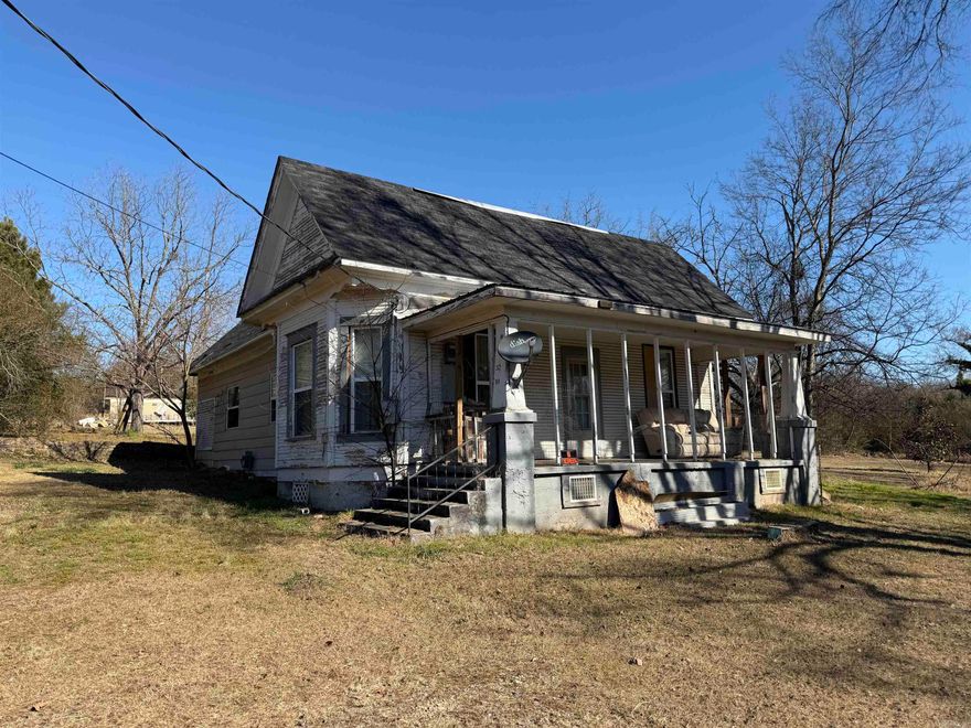 Charming Victorian fixer-upper overlooking the Arkansas River Valley, located on just over 2 acres with a 16×40 frame building and a detached shop/single-car garage, + mobile home w/ little to no value given; partial updates include newer wood flooring, updated windows, insulation, and an updated bathroom, while original moldings, a formal dining room, large laundry, and a cozy country kitchen with wood accents, breakfast bar, refrigerator, and gas range retain the home’s character; additional unfinished upstairs space offers room for expansion, and the property includes two septic systems with full utility hookups at the frame building/mobile home site, a survey divided into two tracts, and is priced accordingly for the handyman or investor ready to make it their own.