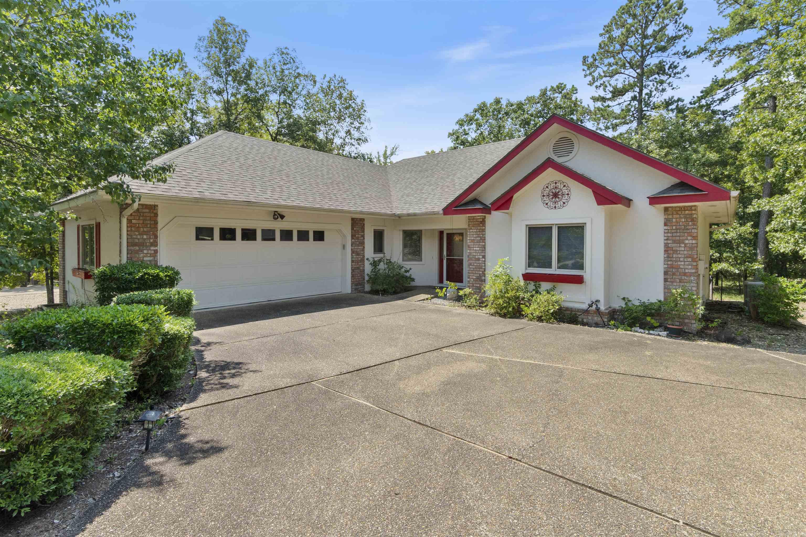 Explore this fantastic opportunity at 32 Promesa Place in Hot Springs Village, Arkansas! This engaging home features three spacious bedrooms, two full bathrooms, with a vaulted living room ceiling and brick fireplace offering plenty of room to relax and unwind. The covered deck is perfect for hosting gatherings or enjoying peaceful mornings with a cup of coffee. All appliances convey, so moving in will be a breeze! Situated in the heart of the vibrant Hot Springs Village community, you'll have access to elite amenities like world-class golf courses, crystal-clear lakes, scenic hiking trails, tennis courts, pools, and a fitness center. Donāt miss your chance to live in this lively, scenic setting with endless outdoor adventures right outside your door!