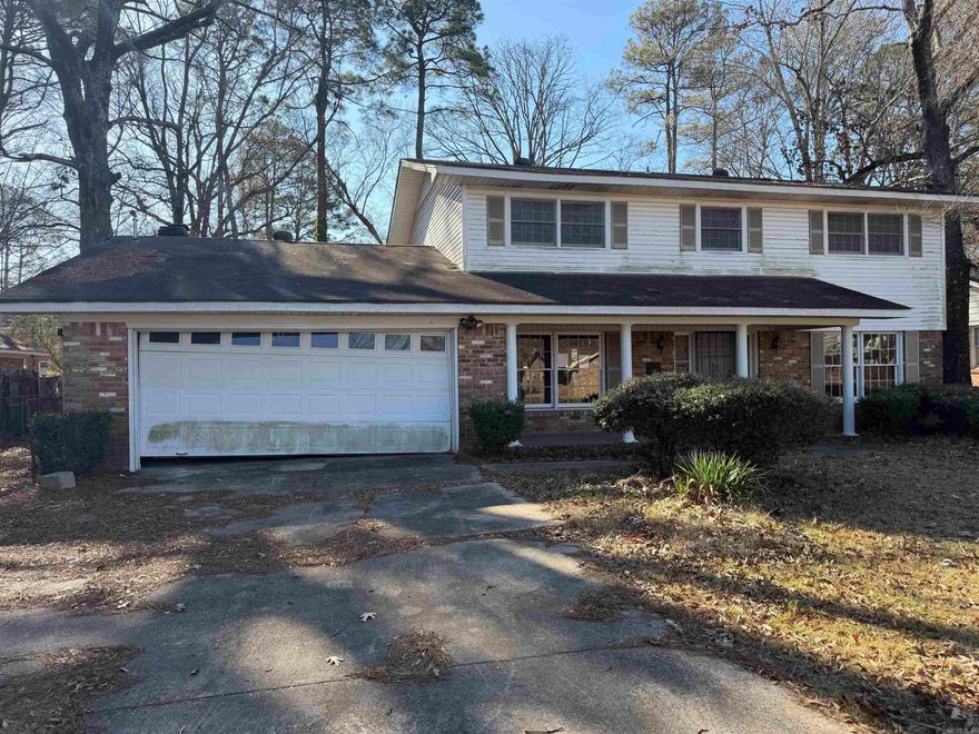 Spacious 3 bedroom, 3 bath home offering 2,483 square feet on a 0.29-acre lot in an established subdivision. Built in 1966, this property presents a true renovation opportunity for investors or buyers ready to add value. The home appears largely original with no significant updates since construction.  Downstairs flooring has already been removed down to the concrete slab, providing a blank canvas for new finishes. Upstairs features original hardwood floors that will need to be stripped, sanded, and refinished. Kitchen and baths are in original condition and will require full updating, including new appliances.  Classic layout with generous room sizes, brick fireplace, built-ins, and an attached garage. Exterior offers mature trees and a level lot. Ideal for a full remodel, flip, or long-term investment. Sold as-is; needs work/TLC. Great potential for the right buyer. Agents see remarks.