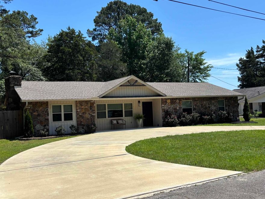 Nicely updated one story 3 bedroom - 2 bath home in the heart of Heber Springs.   Close to the school and an easy walk to Sandy Beach.  New luxury vinyl plank flooring, recently remodeled kitchen and baths, fresh paint and custom roller window shades throughout make this home "move-in ready"! The fully fenced  backyard is spacious and private with a covered patio off the kitchen.  It even has a new storage building!  HVAC system is only 2 years old and the almost new refrigerator stays.