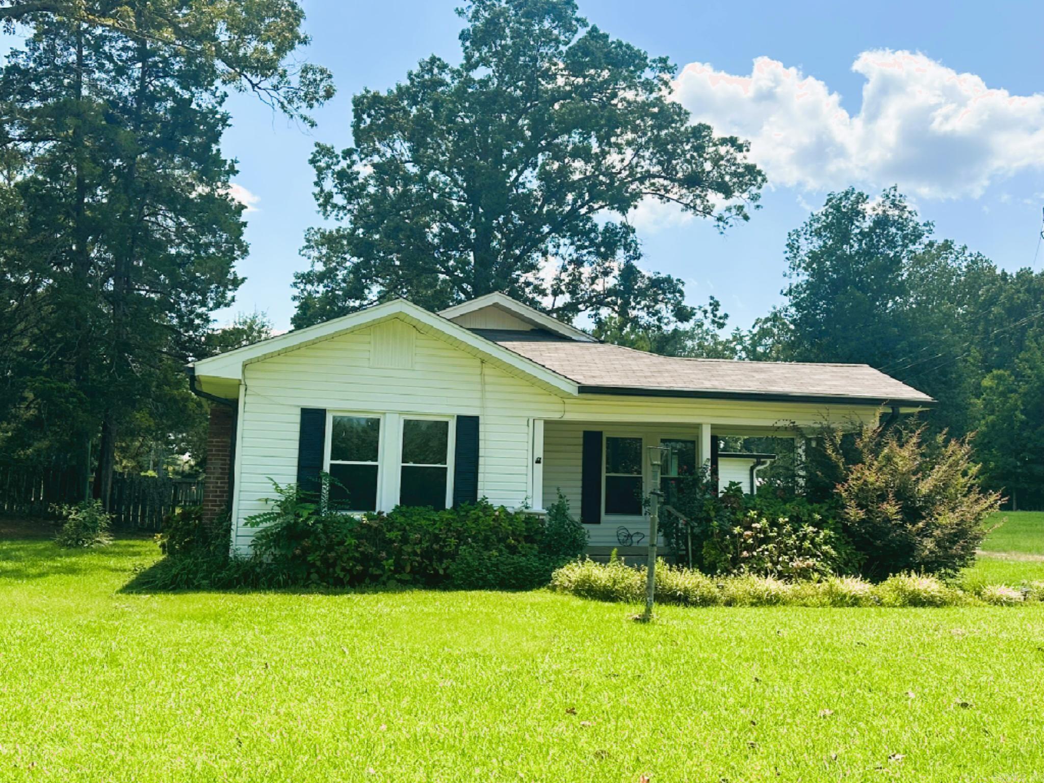 Welcome to your new cozy three-bedroom, two-bathroom house boasting a spacious 1,518 square feet in Crossett sitting on 2.13 acres! Enjoy the comfort of a new roof and gutters with leaf guard replaced in 2025. The third bedroom showcases fresh carpet and paint, adding a touch of newness. This lovely home comes complete with a washer, dryer, and refrigerator, simplifying your move-in process. You'll appreciate the newer vinyl floors and windows, ensuring style and efficiency. Don't miss this opportunity to make this house your home sweet home! Home has city water, natural gas, septic system. Chimney was removed and fireplace is inoperable. Property also has a circle drive that leads out to Thurman Road. The craft shed does not convey with property.