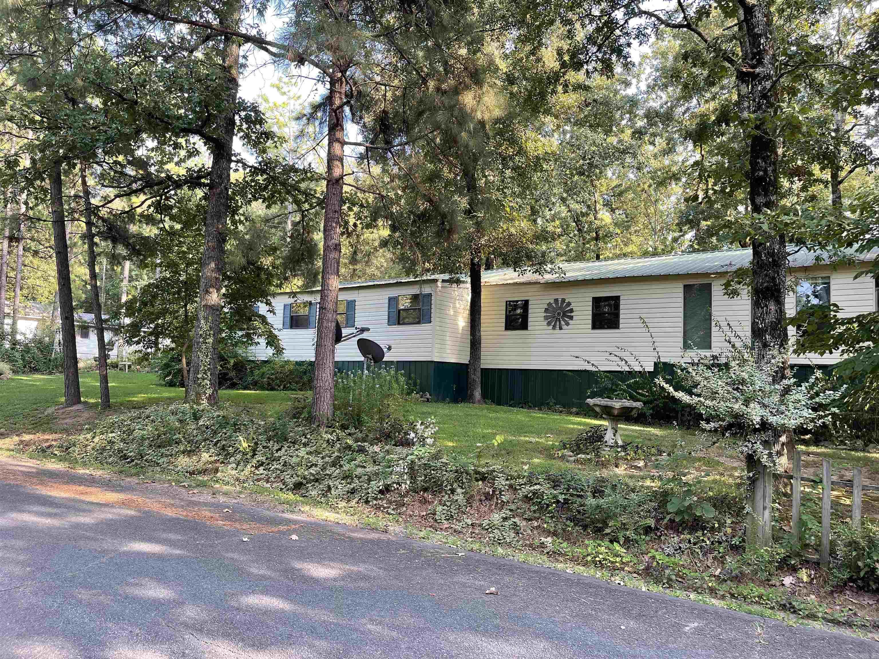 Motivated Sellers!! Look at this cute home in Frontier Canyon! This home has room for all your family and friends plus it is just a half mile to the boat launch. Plenty of parking for lake toys and guests and lots of room outside to enjoy nature. The inside has 3 beds/3 full baths with options to have more rooms. The master bedroom has vaulted wood ceiling with hard wood floors and a separate outdoor entrance. All the appliances were new in 2022 including the 2 mini splits. Large living room with a gas fireplace, tons of storage throughout the home. Some more awesome features about this house are 3 driveway entrances, BBQ patio area, Koi Pond, Fenced dog area, 2 water heaters, city water and well, storage sheds, garage and so much more. Give me a call today!