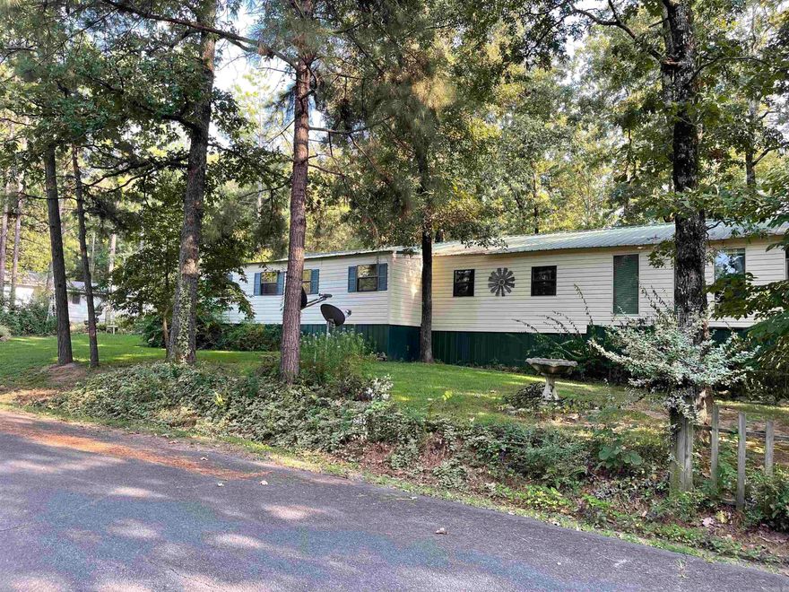 Motivated Sellers!! Look at this cute home in Frontier Canyon! This home has room for all your family and friends plus it is just a half mile to the boat launch. Plenty of parking for lake toys and guests and lots of room outside to enjoy nature. The inside has 3 beds/3 full baths with options to have more rooms. The master bedroom has vaulted wood ceiling with hard wood floors and a separate outdoor entrance.  All the appliances were new in 2022 including the 2 mini splits. Large living room with a gas fireplace, tons of storage throughout the home. Some more awesome features about this house are 3 driveway entrances, BBQ patio area, Koi Pond, Fenced dog area, 2 water heaters, city water and well, storage sheds, garage and so much more.  Give me a call today!