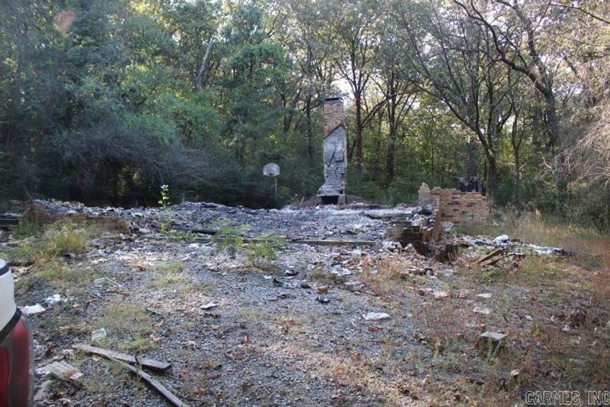 No Disclosure.  To be sold as is.   approx 2.86 acres.  Dwelling on property burned to ground and debris will not be removed. Urge caution when viewing in and around the property.   All offers must be submitted diret by buyer agent on www.propoffers.com.  ARA contact with earnest money addenda and POF must be completed and uploaded. Offer worksheet only to offers@trammellandco.com. Agents please review confidential remarks and docs online.   Cash offers must provide POF dated within last 20 days and show bank name, buyer name, and balance(online banking copies, phone screen shots are not acdeptable).Term offers-see confidential remarks.