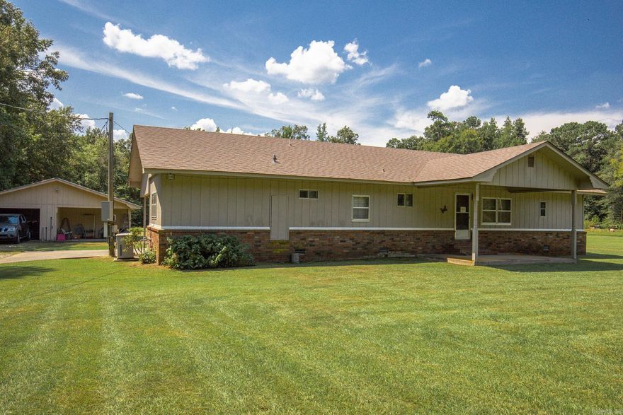 This adorable 3br/ 2ba home sits on nearly 4 acres in a quiet little subdivision on the outskirts of Pine Bluff with no restrictions. It is back on the market at no fault of the seller or home and is priced to sell! This is peaceful country living at it's finest. The separate garage/workshop has a new metal roof and is perfect for your boat and for tinkering! There is a storage building on the property with electricity as well. This home comes with an almost new gas-powered generator that automatically comes on when the power goes out! The roof is less than 10 years old. The heat and air unit is 6 to 7 years old and was just recently serviced. The gas stove is fairly new and the dishwasher is brand new! Brand new carpet in the den and bedrooms. Laminate in the rest of the house was installed 5 years ago, but still looks brand new. This home is very well maintained. It's an older mobile home that has been added on to. It will be cash or in-house financing only. Proof of funds are required before showing. Call today to schedule a time to go look!