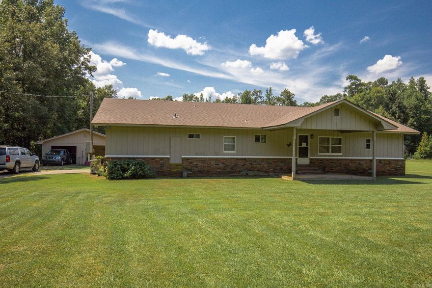 This adorable 3br/ 2ba home sits on nearly 4 acres in a quiet little subdivision and is priced to sell! Enjoy peaceful country living, but not too far from city conveniences. The separate garage/workshop has a new metal roof and is perfect for your boat and for tinkering! There is a storage building on the property with electricity as well. The home comes with an almost new gas-powered generator that automatically comes on when the power goes out! The roof is less than 10 years old. The heat and air unit is 6 to 7 years old and was just recently serviced. The gas stove is fairly new and the dishwasher is brand new! Brand new carpet in the den and bedrooms. Laminate in the rest of the house was put in 5 years ago but still looks new. This home is older but is very well maintained. Older mobile home that has been added on to ( will not go traditional financing) Call today to schedule a time to go look!