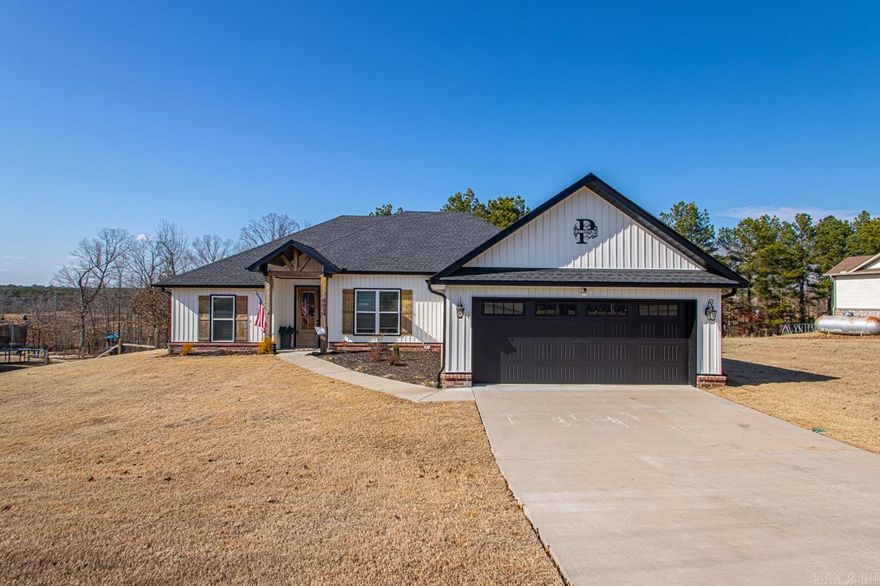 **PRICE DROP** on this GORGEOUS home located in Bauxite on 1 acre! As you enter through the beautiful front door, you will notice the large, open floorplan.  The living room is huge and features a woodburning fireplace! The kitchen is open to the living room and dining and features ss appliances, beautiful granite countertops and a large island! Step through the custom barn doors to enter the office, located just off the living room. This space could also be used as a playroom, dining space, bedroom or any other multi use space as you choose! This home features a split bedroom plan with the master on one side and the 2 additional bedrooms opposite side of the home. The master bedroom is huge and features a stunning master bath with double vanity, soaker tub, amazing tile walk in shower and huge walkin closet. The two additional bedrooms and hall bath are very spacious and feature great storage and closet space.  Step out back onto the large, partially covered deck and onto the fully fenced, huge back yard, where the owners have added extensive sod, landscaping and a french drain! Don't miss out! Schedule your showing today!