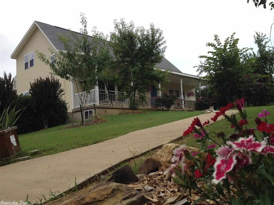 If you want character, not cookie-cutter, this is it!  Incredibly well built home on a beautiful lot! Beautiful landscaping including rose bushes, peach trees, almond trees, and apple trees lead you to the covered front porch.  Inside, you will find an open living/kitchen/dining area, as well as an unfinished basement with 384 sq.ft. store room!  The sun room looking over the back yard is adorable. The home also features an extremely high-efficient zoned heat and cooling united rated SEER 21.