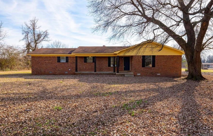 Tucked quietly off Harper Road, this brick home sits on 2.66 peaceful acres where mornings feel slower and the open land creates a true sense of retreat. The long drive leads to wide, cleared space, mature trees, and plenty of privacy. Inside, the home offers warm, comfortable living with natural light throughout and a cozy wood-burning fireplace for quiet evenings. The kitchen and dining area flow easily together, and the two bedrooms and two full baths make daily living simple.  The land is the true highlight — usable, open, and full of potential. With lean-tos, a pump house, and a large barn-style structure, there’s room for projects, equipment, animals, or a future workshop. Whether you want space to spread out or acreage to enjoy, this property adapts to your lifestyle. Just minutes from Little Rock conveniences and close to river access, it offers a rare blend of privacy, comfort, and opportunity.