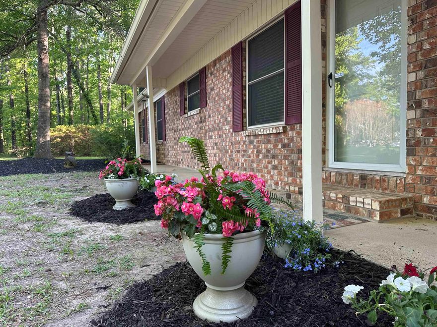 Country living, close to town on 5+ Acres with a creek and sparkling 18x36 Pool!  Summer fun starts here’s and the childhood memories will last forever.   The  shop and additional large storage buildings provide the perfect place for hobbies, home business or even a perfect spot to create the dream man cave/she shed!    This classic ranch style home allow you plenty of room to roam and grow some great memories or even a garden for your family.  With over 2,000 sq ft of open living space on one level this 3 bedroom and 2 bath home offers new paint, LVP floors, brand new roof and updated windows throughout.   The updated appliance package including stainless steel Refrigerator, gas stove, dishwasher and microwave are a great bonus.  With a laundry room outfitted with washer and dryer all you need is your furniture and your set to live life fully in your new home!  The master suite not only offers huge picture windows with a special forest view and a peak at the pool…you will also have plenty of storage in the walk in closet and a great place to wind down at the end of the day with the spa like jetted tub and large walk in shower.    A two car carport is ready for you when you arrive!