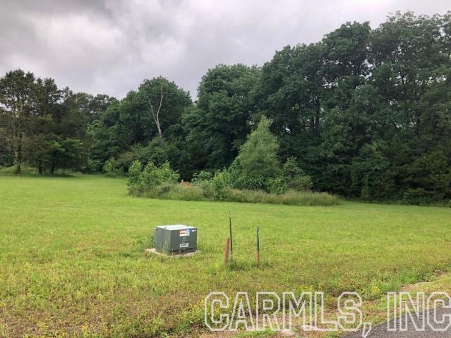 This Lovely building lot only minutes from amenities of town, with underground utilities is perfect for beautiful new home~ This lot is partially cleared already, but still has some wooded area as well.