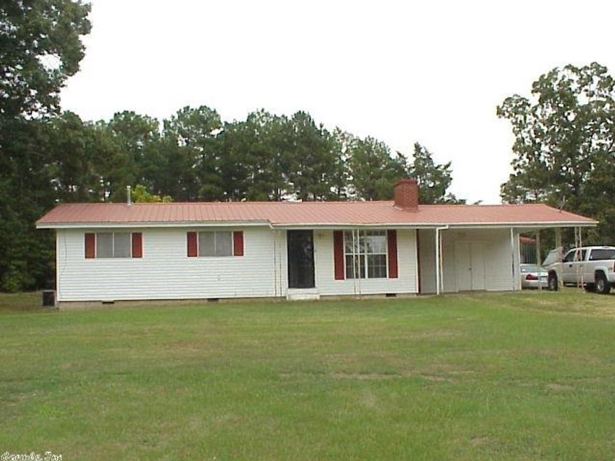 Well cared for home w/ updated Kitchen, New water heater 2012, metal roof & hardwoods under nice carpet * Storm Shelter for peace of mind * 30 x 12 shop w/ extended covers for boats & more, plus 16 x 12 storage w/ electricity * Large utility room w/ full bath * vinyl sided exterior for low maintenance * large dbl carport w/ large storage closet * easement across portion of front for neighbor access on this 1.57 acre site with Hwy 16 frontage. *****   Seller paid $2,500 of Buyer's closing costs at closing