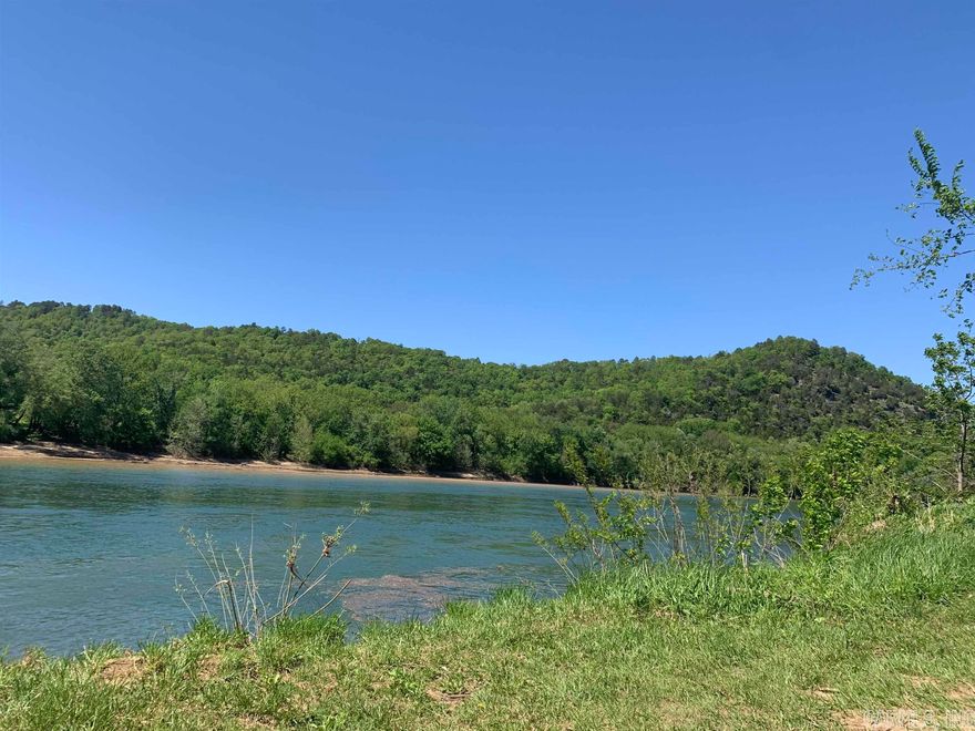 Location, location, location! Gorgeous residential lot fronting White River just minutes from the music, eateries, and shopping of Mountain View! This pristine lot offers approximately 1.16 acres and conveniently adjoins the Arkansas Game and Fish's public access and boat ramp where you can literally launch your boat and be on the water within minutes. This is one of the best areas for fishing on the White as it is regularly stocked by AG&F. This lot is ready to go with public water and electric onsite, and fiber optic internet availability. This River Valley area is a great neighborhood with spectacular sunsets and night skies! The Bill of Assurances and Covenants ensures the Round Bottom Pool Estates remain desirable and safe.