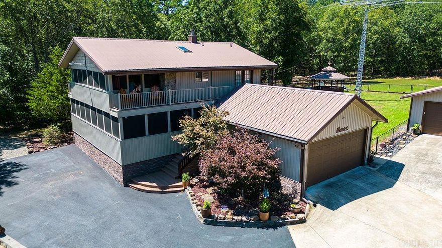 PRISTINE HOME across street from Greers Ferry Lake. This home has everything you need, hot tub, screened in porches with composite decking, two double garages, storage shed, Rv storage with concrete pad, updated kitchen,  sprinkler system, circle drive, gazebo, on 1.65 acres.  The home itself has tongue and groove pine ceilings, real hardwood floors, 2 marathon hot water heaters, gas fireplace, trane heat & air central unit along with mini splits and fabulous master suite!!! Just down the street is private boat launch and picnic area for subdivision and is also just minutes from Old Hwy 25 Park. Furniture and lawn equipment negotiable. ***Large Antenna in Pictures has now been removed from property***