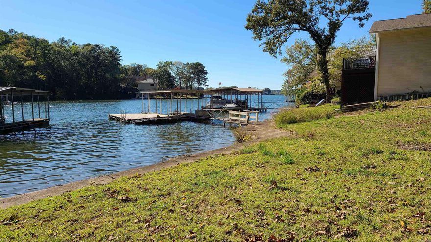 Build your dream home on this gently sloping Lake Hamilton lot, just minutes from everything the Lake has to offer via boat. This lot features a Covered Boat Dock, swim deck and a private launch ramp. All utilities available for a new construction! Located out of the City Limits.
