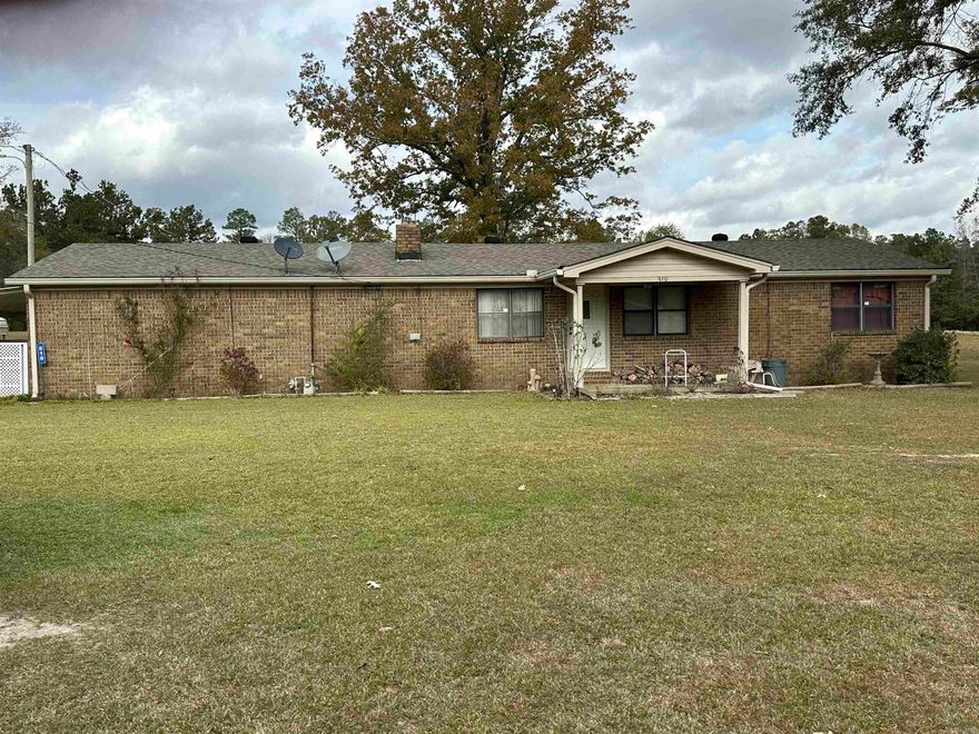 Brick Home on 1.5 Acres – 519 Country Trail Lane, Star City, AR      Features:    •   2 Bedrooms, 1 Bath with 2 additional rooms that could easily convert into bedrooms.    •   1,632 sq ft of living space, built around 1970.    •   Wood-burning fireplace, central electric heat/air, and a gas wall heater for emergency heat.    •   Outdoor perks:       •   12x8 covered front porch       •   22x8 open side porch       •   Shop area and carport    •   Located at the end of a dead-end road for privacy and peace.    •   Roof replaced approximately 5 years ago.    •   Nestled on 1.5 acres with plenty of room to enjoy country living Agents see Remarks
