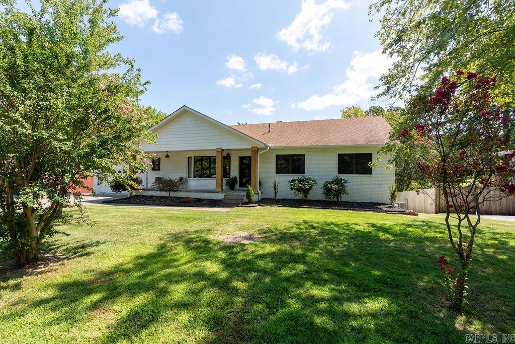 PRICE IMPROVEMENT: This remodeled upscale 3 story home has 2 kitchens, new appliances, new flooring, 2 heating/air units, all bathrooms have luxurious ceramic tile, plus added square footage for media/bonus room above main floor with mini split heating/air. Main floor has 3 bedrooms and 2 full baths. Lower level has second kitchen, wet bar, living room, game area, 3 bedrooms and 1 bath including an extra large storage area that would work well as a safe room. Sit on the deck to enjoy the large back yard and Greers Ferry Lake is only minutes away. Comes with a extra storage building. It has the convenience of being in town and only 6 minutes from the nearest marina. This home could easily house 2 families.