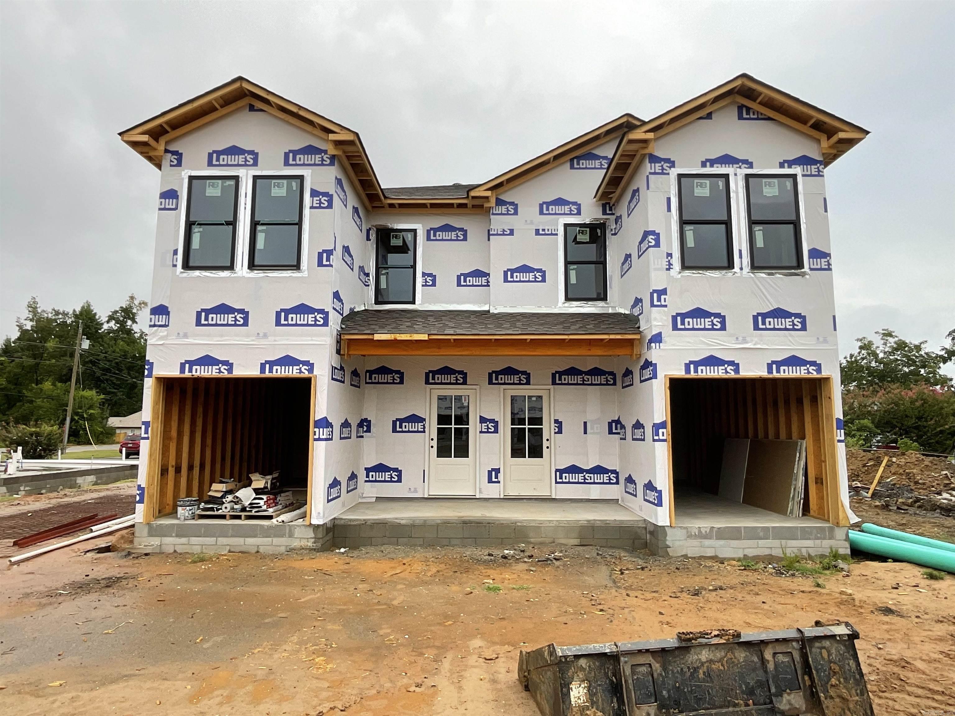 Look at these beauties! All brick/stone NEW CONSTRUCTION DUPLEXES in the heart of Jacksonville! Each unit is 3bed/2 1/2 bath! One car garage opens into the downstairs living space with a half bath for convenience. Upstairs contains primary bedroom at the back with its own bathroom and walk-in closet, as well as two additional bedrooms with a bathroom in-between. Hall laundry makes for the ultimate in convenience! Luxury vinyl throughout will make this renter-ready! This building has a twin going up next door. See 215 & 217 N Elm to see an example of the inside finishes! **First picture is next door, while 400 & 402 is foundation only right now. FRAMING SOON! SEE 404 & 406 for layout*