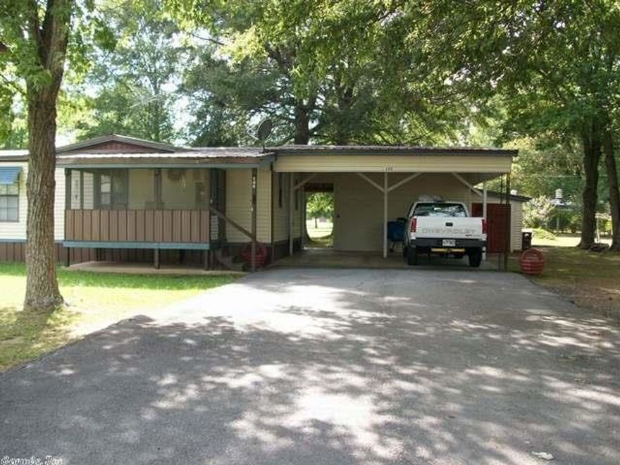 Very well kept with an eat in kitchen with fresh paint & lots of cabinets. All appliances including washer & dryer will stay. Nice size living room, new toilets, tub and sink.  Master bedroom is huge & has a walk in closet. Closet with built in drawers, & desk in 2nd bedroom. Nice metal roof, Metal siding, double carport, & wired workshop with workbenches & built ins. Everything is so neat and well cared for ! Lots of trees & nice newer storm shelter in this yard. May qualify for in house financing