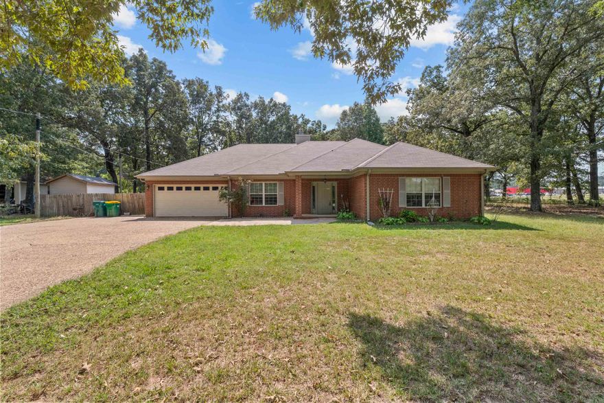 BEAUTIFUL move-in ready home on a peaceful .82-acre lot! This 3-bedroom, 3-full-bath property offers an incredible combination of space, comfort, and updates. Featuring two private bedroom suites, this home provides flexible living options for family, guests, or multigenerational living. Inside, you’ll love the easy-care flooring, spacious living areas, and cozy fireplace that make this home both stylish and inviting.  Step outside to enjoy a large screened-in patio overlooking the serene country setting, perfect for morning coffee or evening relaxation. The home also includes a newer roof, whole-home generator, and extra parking, offering convenience and peace of mind. A storage unit adds plenty of room for tools, hobbies, or seasonal items.  With beautiful curb appeal, modern updates, and a private setting that feels like your own retreat, this property truly has it all. Don’t miss this amazing home—it’s ready for you to move right in! (See Agent Remarks!)