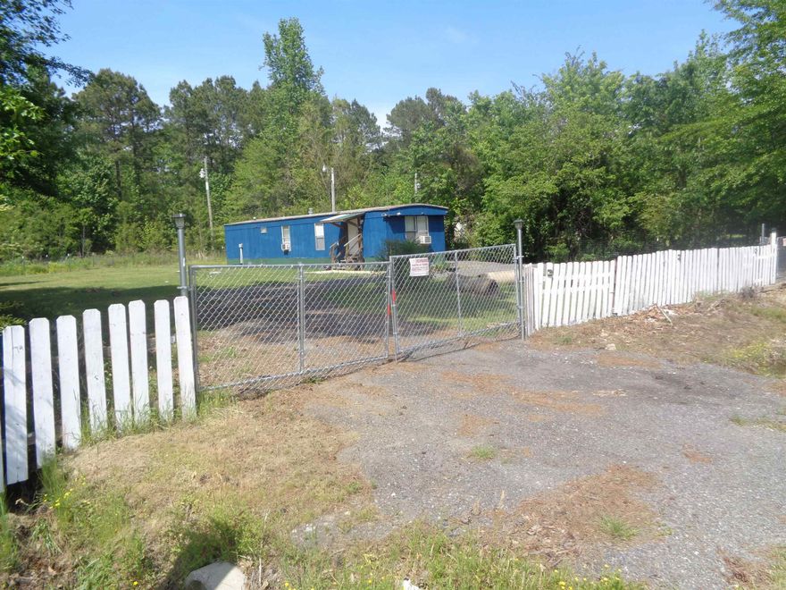 Very, Very clean 2 bedroom mobile home on .36 of an acre lot. Seller has made this property extremely nice. Kitchen stove, refrigerator, window air units and heaters are to convey. Washer & dryer to remain with an acceptable offer only. This would make a really good investment property or a just right for a First Time Buyer wanting some "Elbow Room". Agents please check remarks section.