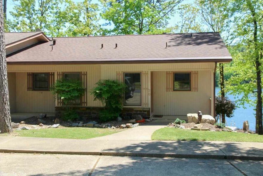 Unusual open floorplan , end unit, on Lake Desoto. 2/1.5, end unit with new paint inside and exterior, new carpet on main & LL,  popcorn ceiling removed on main level, extensive new landscaping, new dock with lift, new screen porch on entrance level, new HW heater in 2012, gutter guards, LL patio with great lake views. Furnishings negotiable.