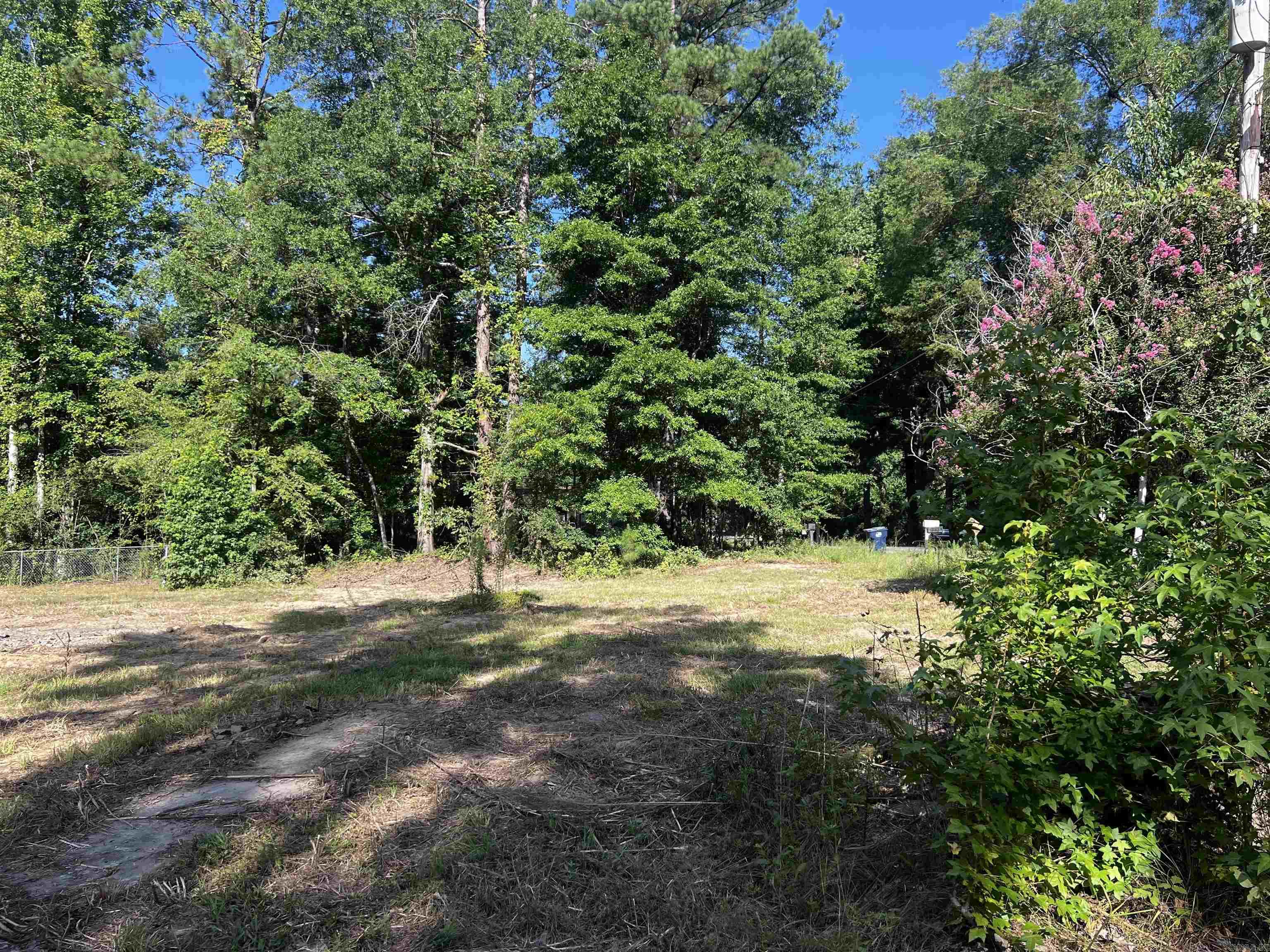 An excellent spot ready for development! Looking to build outside city limits? This property is ready for you! Driveway in place from previous homesite. Call our office for more information.