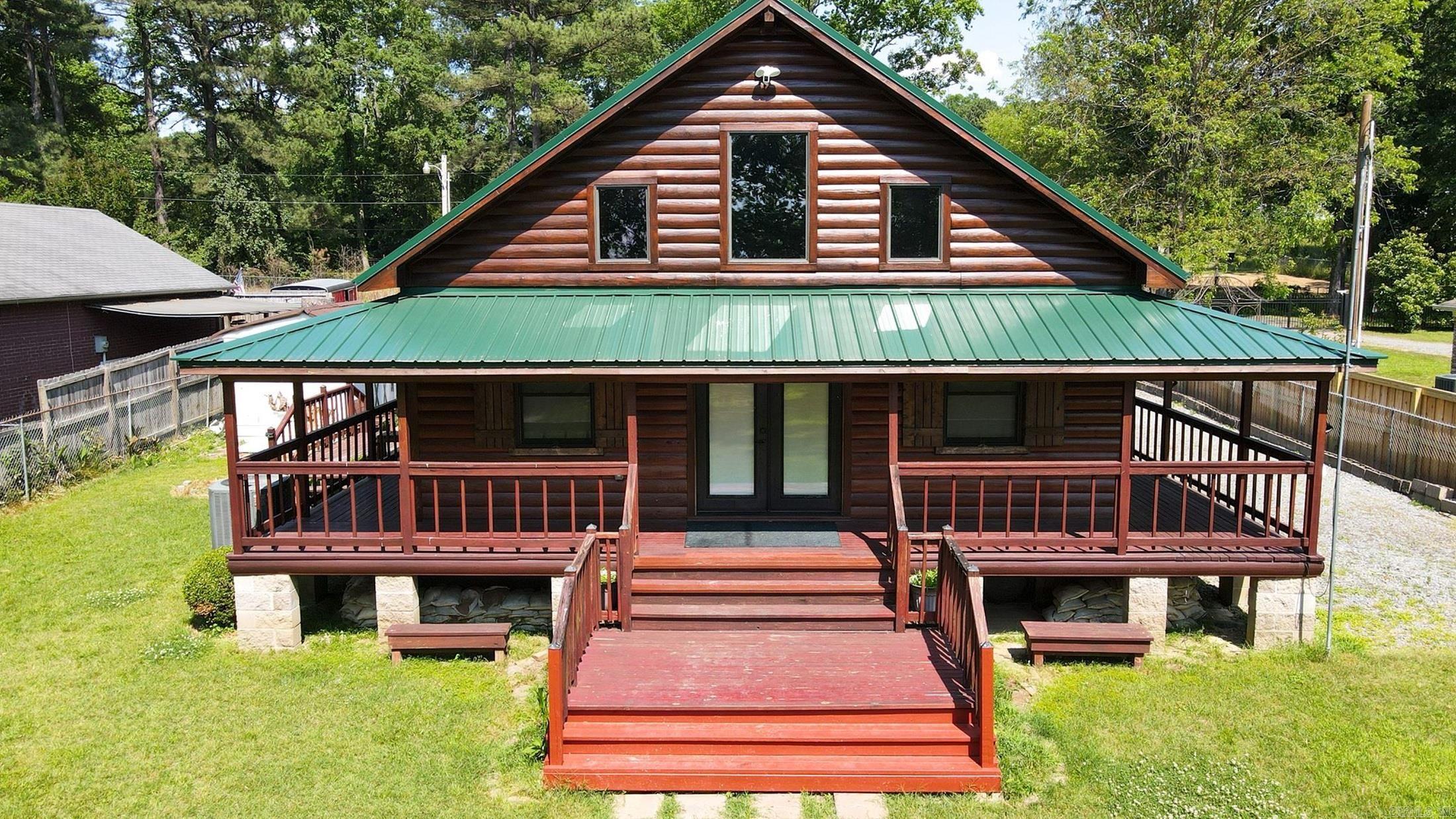 Welcome to your perfect lake getaway! This charming cabin with a durable metal roof sits on a leveled lot just steps from Lake Conway. The open-concept layout creates a warm, inviting space, while the wraparound deck is ideal for relaxing outdoors and enjoying the peaceful setting. This property comes fully furnished, including the refrigerator, making it move-in ready for your own retreat or an immediate start as a vacation rental/Airbnb. It also features a new septic tank, and the dock is currently being rebuilt for your future lake adventures. Lake Conway is temporarily drained for dam repairsāonce refilled, it will once again offer some of the best fishing in Arkansas.