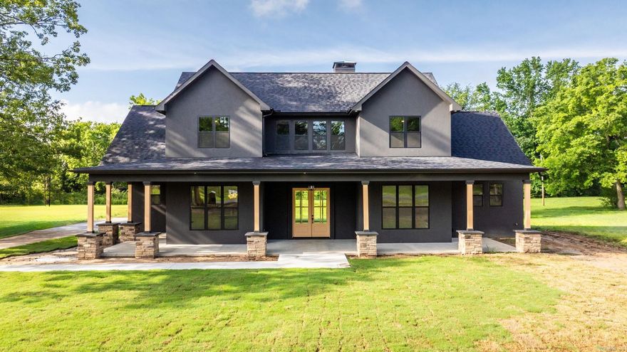 This stunning 6-bedroom, 4 full bath, 1 half bath custom-built home is brand new construction and offers 4,900 square feet of thoughtfully designed space in the heart of Alexander, Arkansas. Key Features: Spacious 3-Car Garage with its own full bath—perfect for backyard access and clean-up / Quartz Countertops & Tile Flooring with a huge kitchen / Massive open-concept main living area with a striking stone fireplace (gas or wood-burning option—see agent notes!) / Elegant primary suite just off the living area, complete with a walk-in closet, soaking tub & separate shower / Cozy den conveniently located near the living area and primary suite / Upstairs offers even more space to live and grow: A secondary gathering area, upstairs laundry hookups/ Four additional bedrooms, 1 full bath + 2 half baths / An oversized bonus room ideal as a game or playroom / Multiple storage areas, with attic access that could qualify as additional square footage. Stackable laundry room. This home checks every box. And for the price, you won't find another like it! Schedule your showing today!