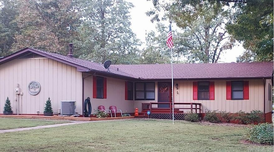 Discover your Ozark retreat with stunning year-round views of Lake Norfork from this beautiful 3-bedroom, 2.5-bath home on 10 acres M/L adjoining the government strip. A gentle slope leads to the Corp line, with easy access down a quiet gravel road and a boat launch less than 10 miles away. Inside, enjoy freshly painted interiors and a spacious kitchen with custom cabinetry, new countertops, and a large island with all appliances included. Recent updates include a new roof, wiring, pressure tank, hot water heater, refrigerator, and dishwasher for peace of mind. Relax by the cozy pellet stove or unwind on the back deck and take in unforgettable Ozark sunsets. The property also features a whole-house fan, attached garage, and a 2-bay shop with loft ideal for hobbies or storage.This home perfectly blends modern comfort with the natural beauty of the Ozarks. Listed at $449,000 make your lake view dream home a reality.