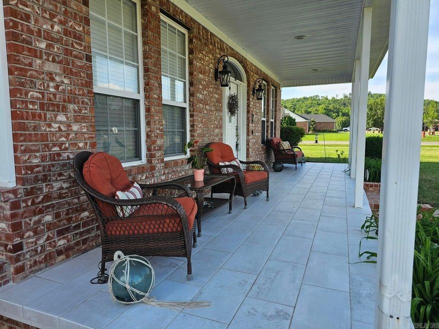 Cove Landing corner lot: 3 bedroom 2.5 bath w/ 9 ft ceilings throughout. Tiled front porch is quite inviting. BIG living room, kitchen and pantry. Enjoy the gas fireplace this fall. Propane tank for it conveys w/the home as do the washer, dryer, refrigerator, & Ring doorbell (buyer will need a subscription for service). It offers a breakfast area & a dining room & lovely entryway. Surround sound & volume controllers are installed throughout the home. The master bath has a jetted tub & separate step-in tiled shower w/ bench. Master walk in closet has entrances on both ends. There is a very nice handicapped accessible step-in tub/shower in the hall bath. Large backyard has a new patio & a storage building, all inside a vinyl privacy fence. HOA fee is $65 per year.