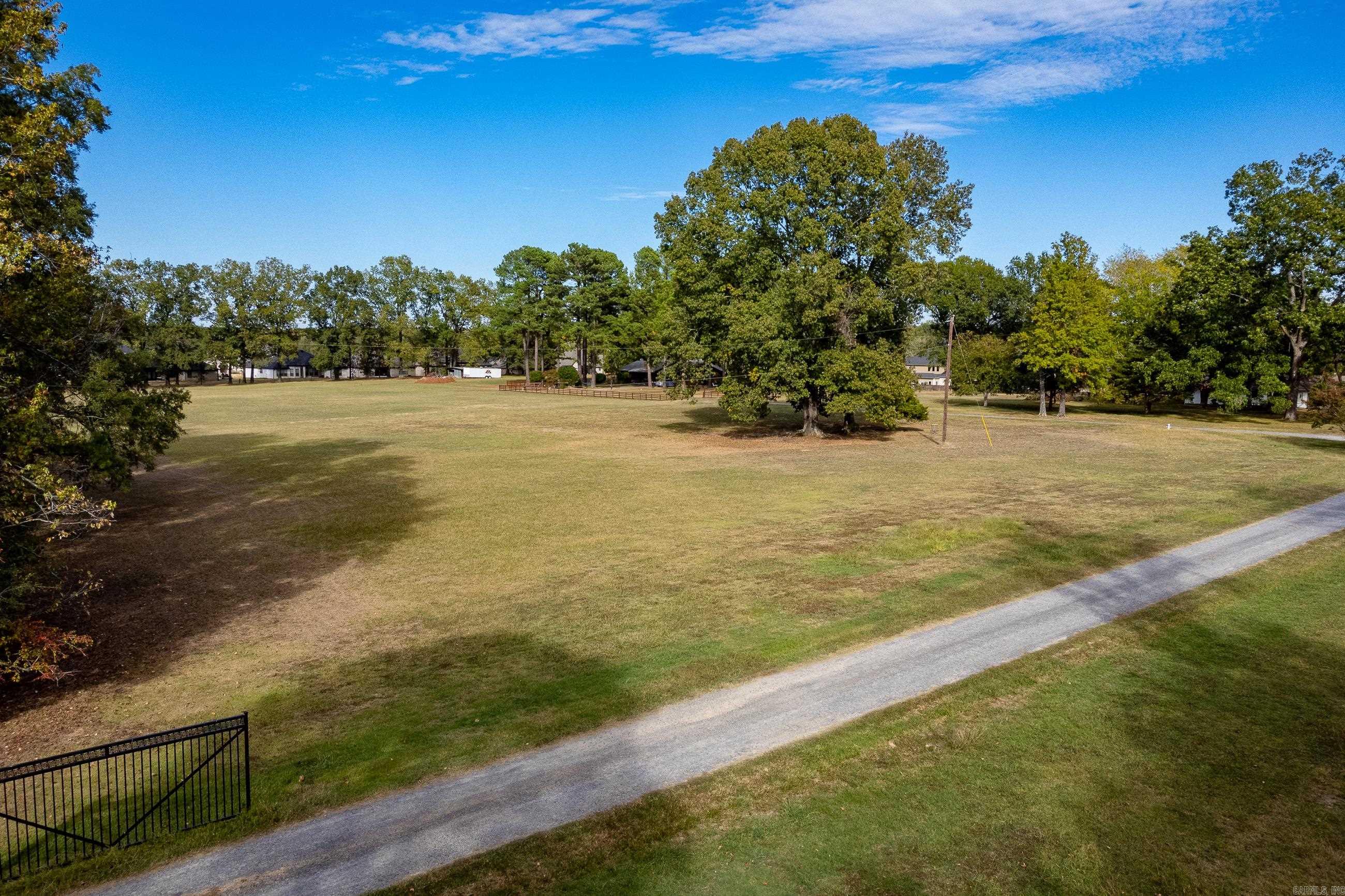 Prime Residential development land. Has utilities. Subdivisions next door have homes in the $500-$700,000 range. See Documents for more details including water easement, demographics and boundary survey. Currently has 2 homes on the property. Value in land. Access road goes to White Oak/Counts Massie. Land is flat and perfect for building homes.