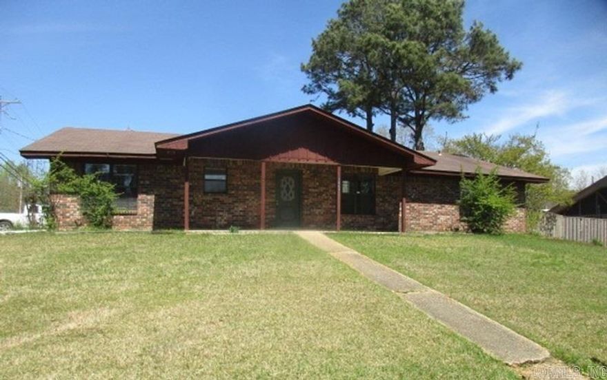 Brick home on corner lot.  Good floor plan.  3 bedrooms and 2 baths, fenced in backyard, double carport.  This home awaits your personal touch to make it great.   Call Listing Office to schedule appointment to view the home.  **Agents see Remarks**"