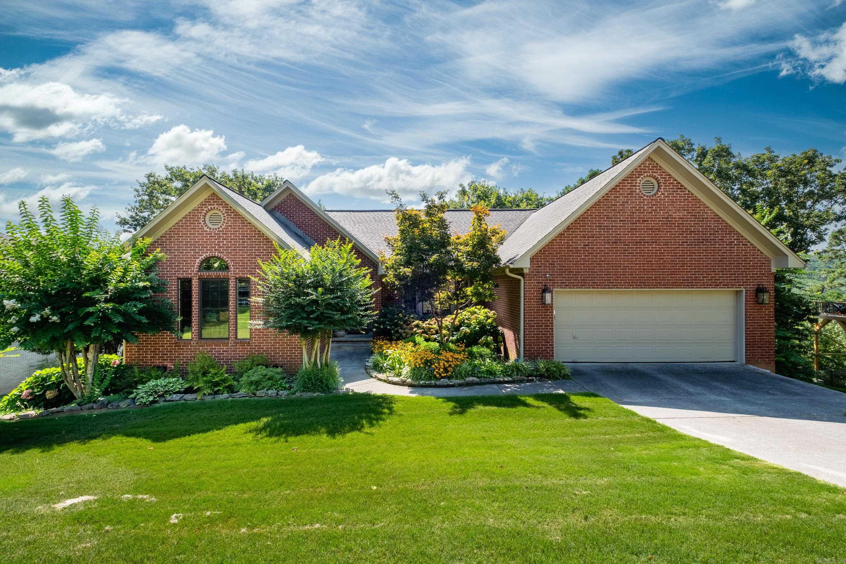 Stunning view from this updated family home. Gorgeous sunrises await as you overlook Little Rock. Secluded cul-de-sac is the setting for this home with great room overlooking west Little Rock, totally updated kitchen w/large breakfast area, study and master suite which opens to deck w/a view and an update master bath. The lower level offers a large family room w/wbfp and....of course a view. 3 bedrooms, 2 baths, a bunk room that can accommodate 6, plus a workout room equipped with a treadmill. Recently replaced site finished hardwood floors, Maple butcher block island in kitchen, designer cabinetry in kitchen and plenty of space to enjoy the view from a partially covered deck of the great rm & MBR.