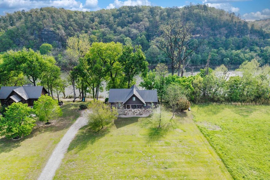 Nestled on 0.97 AC along the serene banks of the White River, this beautiful home offers the perfect blend of comfort, charm, & nature. 3 BRM, 2.5 BTH, open floor plan for both relaxing & entertaining. Front porch has countryside views or enjoy your morning coffee from the screened-in deck overlooking the river. The kitchen has an abundance of countertop space & ample storage. All appliances, including W & D, are included. Most furnishings will be conveyed, making this home truly move-in ready. Utility room, 2nd BRM & full BTH are also on the main floor. Loft includes a sitting area with breathtaking river views, a 3rd BRM, and 1/2 BTH. Outdoors: stone steps lead down to the river's edge, plenty of parking. Storage under the home is perfect for tools or outdoor gear. With a Game & Fish launching area close by, this riverfront gem is a dream come true for outdoor enthusiasts.