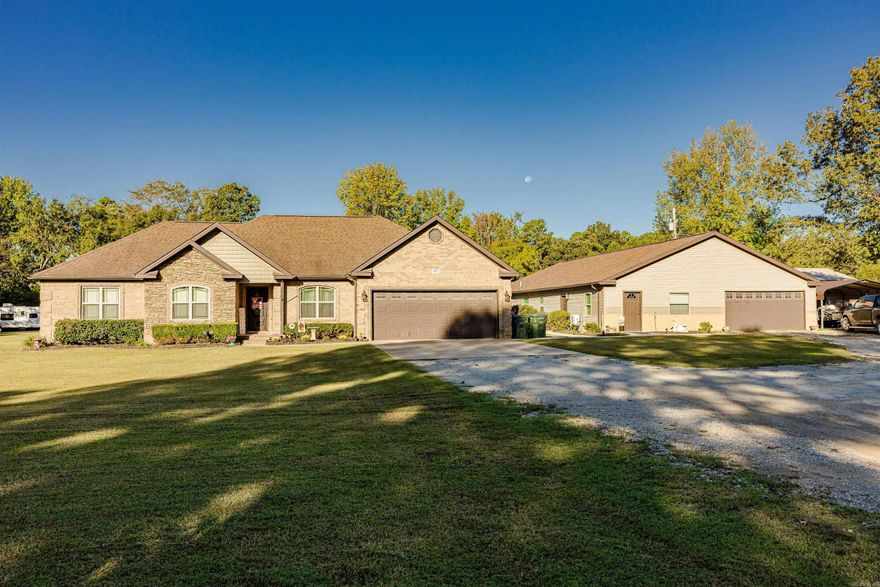 This property is truly one of a kind...a must see!  The main house in 2262 sqft with 4 bedrooms and 2.5 baths, chicken coop, fenced in back yard, and more! The main house has tile and laminate style flooring throughout (only carpet is in master closets).  The kitchen features custom cabinetry and bronze colored appliances.  The living room is spacious with a gas log fireplace.  The master suite has dual vanities and closets, along with a separate shower and tub.  The second "house" has a 1222 sqft recreational area, a 1010 sqft guest house, and a 684 sqft shop/garage.  In the recreational area, there is a huge living area, 2 good sized rooms, kitchen area, and a half bath.  In the guest house, you will find 2 bedrooms and one full bath...along with a large separate back yard. Need the in-laws close? Have older kids still at home? Airbnb?  This place has endless possibilities, so call today for your private tour!!