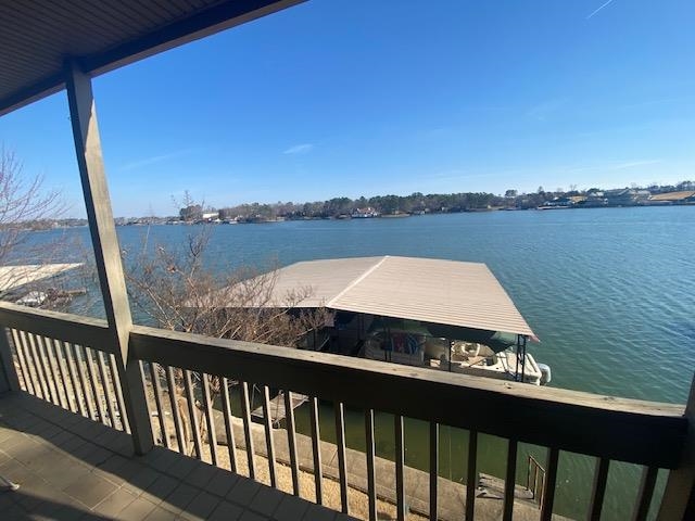 THE PRICE IS RIGHT. Walk right into this one level unit. Magnificent view of Lake Hamilton. Two bedroom/Two bath. Glass doors open onto the deck from the great room and the primary bedroom. Covered Deck area has 216 SF. Covered Boat slip included-$200/year, Condo fee $300/month includes water, termite, insurance, pool. Private pool and pool house and tennis courts, gated, and ground maintenance. Most furniture to convey. Come see and make this your summer vacation home. Less than ten minutes from Oaklawn Track and Casino. Very well maintained. Easy to show.