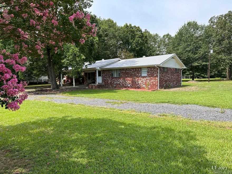 House on 6 acres with a stocked pond. Property features 2 main bedrooms on the North end of the house with two smaller rooms on the South. One could be used as bedroom and the other as an office. Has separate laundry room, storm shelter, and sunroom. Plenty of open land for a garden and has a shop too. House was renovated in 2022 with new metal roof, new carpet, flooring, new appliances, and new paint.