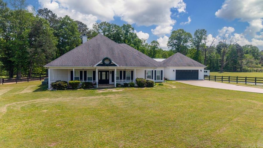 Country Setting with City Convenience.... Amenities Include: Approximately 2880 SF, 4 Bedrooms, 3 Bathrooms, Large Bonus Room, Great room with wood burning fireplace, Open Floor Plan, All Bedrooms Downstairs, Office, Kitchen/Dining Combo, Living/Dining Combo, Breakfast Bar, Pantry, Wrap around front sitting porch, large covered patio overlooking inground swimming pool, 2 Car Garage, 60' x 80' Horse barn ( with stalls, tack room, indoor riding area, shop/tractor area ), shop/utility building, wood fenced 4.85 level acres, Bryant Schools, and Much More.....