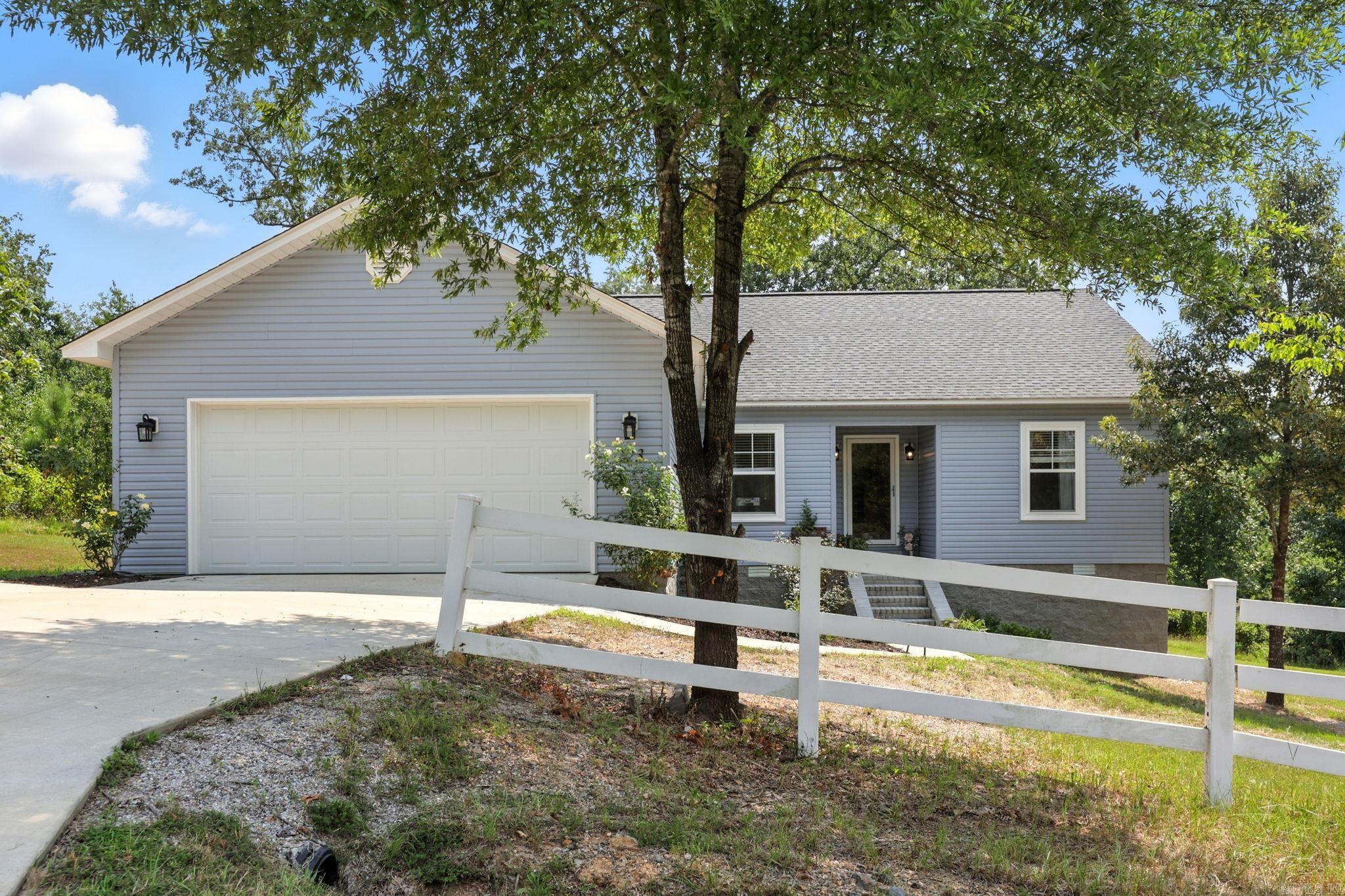 Located just a few blocks from Lake Hamilton, this beautifully maintained and thoughtfully designed home, built in 2023, offers modern living with plenty of space! Featuring 3 bedrooms, 2 full bathrooms, this house is perfect for families. It has a dedicated office that can easily serve as a hobby room or whatever suits your needs. The open floor plan highlights luxury vinyl flooring throughout and a cozy gas log fireplace, ideal for relaxing evenings. The roof is only one year old, providing added peace of mind. Sitting on a spacious 0.41-acre lot, there is ample room for outdoor activities and potential landscaping. Priced at $295,000, this move-in-ready property combines convenience, comfort, and quality construction near one of Hot Springsā most sought-after lake communities.