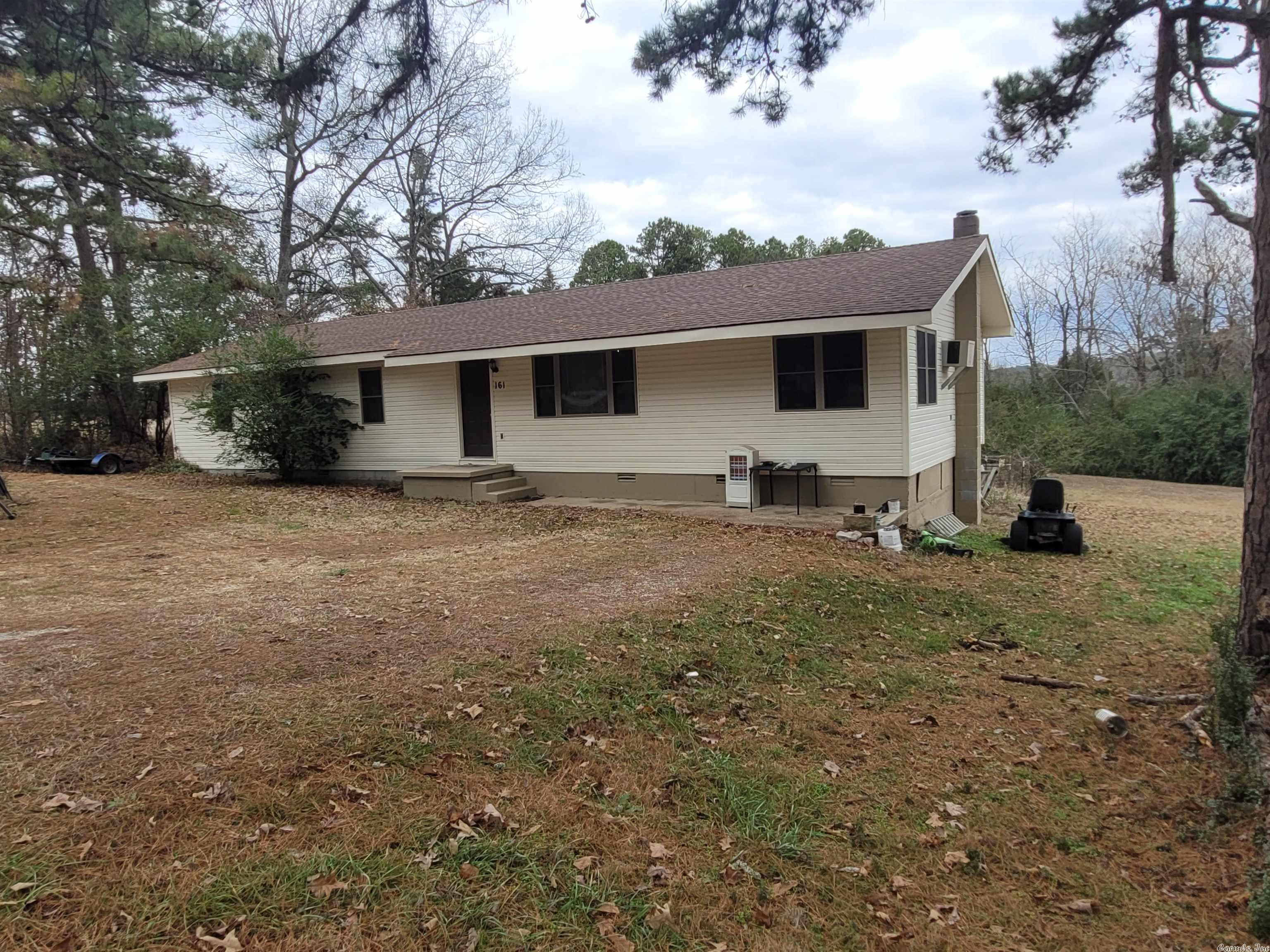 Check out thisĀ country home in Melbourne, Arkansas. The property is near recreational amenities like the White River &Ā Ozark National Forest, butĀ close to schools and shopping. Melbourne is the county seat in Izard County and located in the foothills of the Ozarks. This is an older home with manyĀ new updates including roof, vinyl siding, andĀ insulated windows throughout. It has 3 bedrooms and 2 baths. With the carport being enclosed, the living room boasts a dimension of over 29 feet long and has a wood burning stove as well as hardwood flooring. It has a roomy kitchen/dining combo with a large covered deck. The home feels larger than 1,500 square feet. It is county water/sewer and all electric, but natural gas does run along the road should you want to connect to it. The kitchen appliances stay with the home. There is an old barn & shed on theĀ beautiful 2 acre yard with large pine trees. There is plenty of room for a garden spot and it has a small fenced area in the backyard for pets.