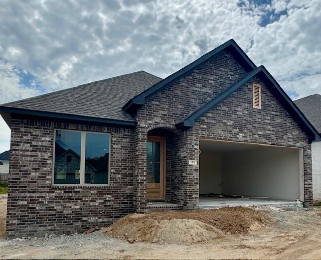 Under Construction - New Construction home in Fletcher Ridge - 3 bedroom, 2 bathroom, 2 car garage. Features custom cabinets, solid surface countertops, stainless appliances, gas cook-top, wall oven, built-in microwave, pantry closet, vented gas log fireplaces, tiled master shower with upgraded energy efficient packages that include foam insulation in the exterior walls, HVAC systems with a fresh air intake. Agent owned. Estimated 60 days from completion.