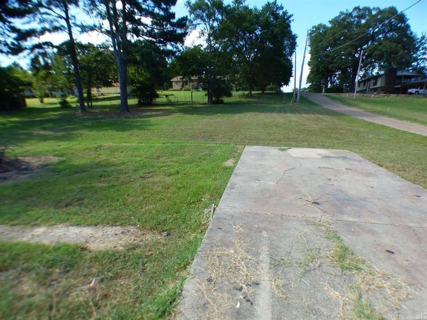 3 lots for sale which previously had a home.  There is a well & sewer present but hasn't been used in several years.  Concrete driveway/pad present on lot.  There are deed restrictions, no more than 2 homes could be built on lot.