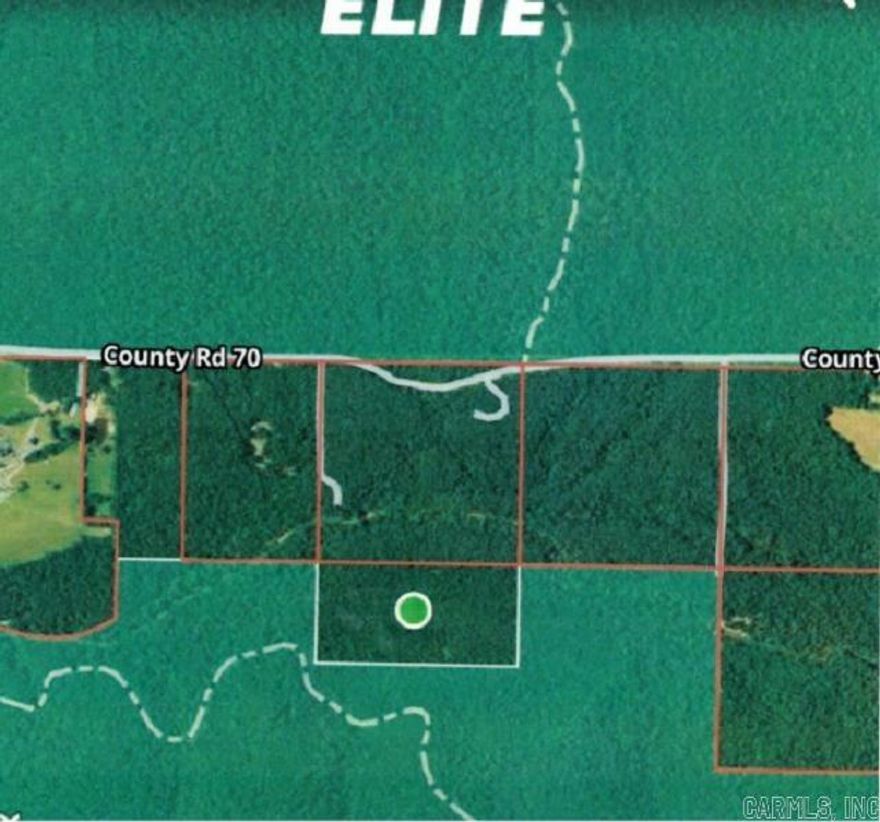 OFF THE GRID!!!  RARE OPPORTUNITY TO OWN a property surrounded on 3 sides by the Ouachita National Forest, with the Irons Fork of the Ouachita River near the  4th (north) side only 50 yards away.  Here is a 20 acre tract that may only be accessed through the National Forest by a permitted Forest Road and might be called "off the grid".    If you are looking for a place to "Hide Out", this one is a must see.  Offered only through owner financing (speak to the Listing Agent about this).  If you are into ATVing and hunting, here is access to thousands of acres of National Forest Service lands.  There are lots of deer, turkey, small game, and some bears. Property could be a homesteading dream!