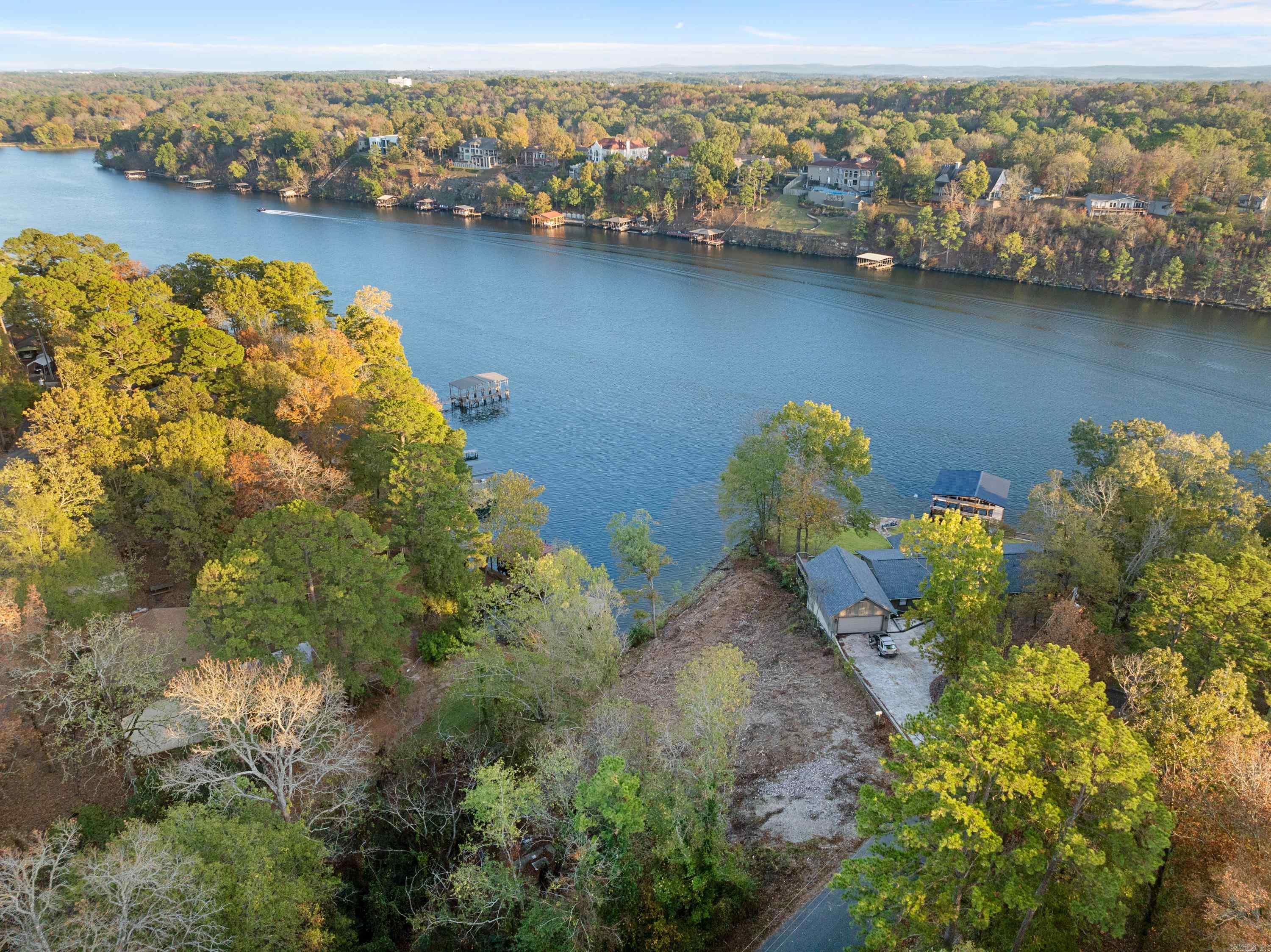 LAKE HAMILTON WATERFRONT LOTS...168' on Lake Hamilton - (2) Platted lots...Houston Drive...City Water & Sewer Available -Possible Owner Financing... Lake Hamilton Schools...Great View! Southeastern Exposure. Build 1 or 2 Houses. Outside the city - No Short Term Rental license required. Survey Available. Great Opportunity.